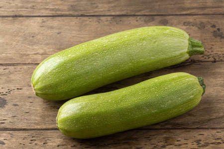 fresh homemade zucchini on a wooden tableの写真素材