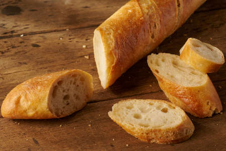 fresh homemade baguette on a wooden background