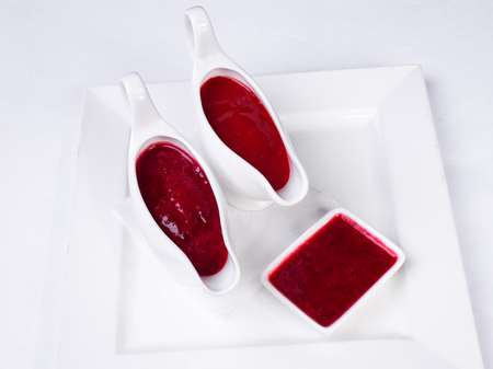Strawberry jam jar isolated on white backgroundの写真素材