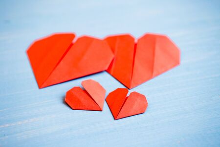 Family prepared for Valentine's Day. Origami of heart. Concept of family. Point of view shot.の写真素材
