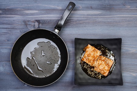 Ingredients for cooking and empty cutting board on an old wooden table. Food background with copyspace.の写真素材