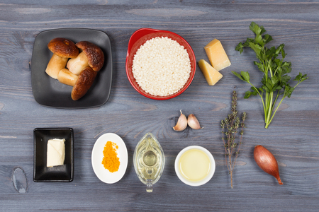 Wooden spoon and ingredients on dark background. Vegetarian food, health or cooking conceptの写真素材