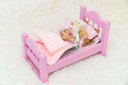 Happy kid playing with toy airplane against summer sky background.の写真素材