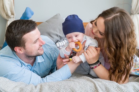 Happy Young Attractive Family with Baby.の写真素材