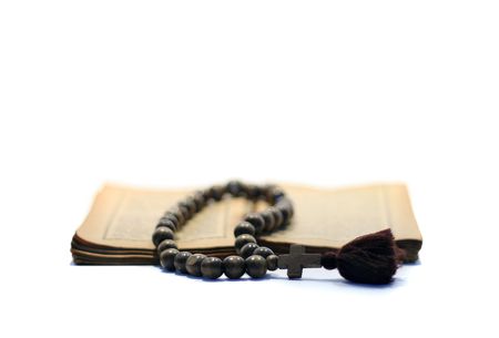 Rosary on antique gospel.の写真素材