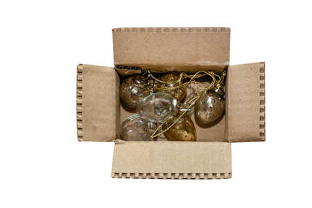 Easter eggs in a cardboard box isolated on a white background.の写真素材