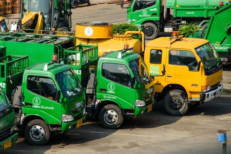 BAGNKOK, THAILAND - NOVEMBER 11, 2014: Row of garbage trucks on a yard. About 2,000 of these trucks currently deployed for grabage collection each day.のeditorial素材