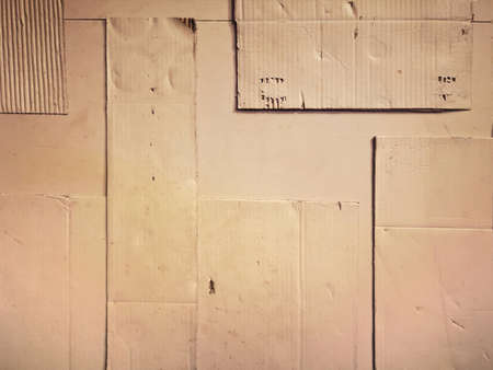 Background and Different texture of the old corrugated cardboard on the wall. Layer of brown packing and recycle paper. Scrap and patch of corrugated paperboard with copy spaceの写真素材