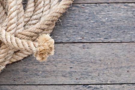 Big navy rope on wooden plank fosucing on the end of the rope, can be use as background of...