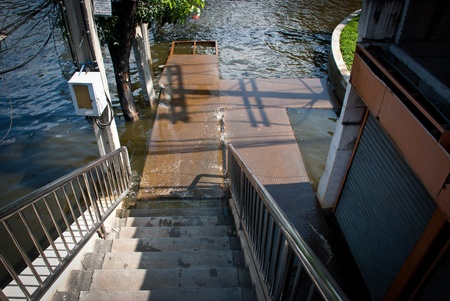 BANGKOK - NOVEMBER 7 2011: A new boat dock in front of Siam Commercial Bank headquarter after impact...