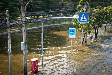 BANGKOK - NOVEMBER 7 2011: The footpath is submerged after impact with heaviest flood and rain in 20 years in the capital on November 07, 2011 in Bangkok, Thailand.のeditorial素材