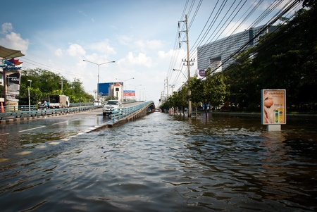 BANGKOK - NOVEMBER 7 2011: Bangkok main road flooded about 1 meter deep after impact with heaviest...