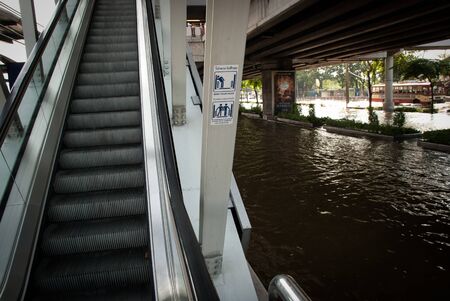 BANGKOK - NOVEMBER 7 2011: Bangkok sky train entrance after impact with heaviest flood and rain in 20 years in the capital on November 07, 2011 in Bangkok, Thailand. のeditorial素材