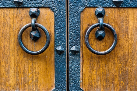 Closeup of wooden vintage door with metal door handle, old medival style taken in Moscow, Russiaの写真素材