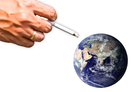 Smoking earth, displaying a large smoker's hand pointing to planet earth. 
の写真素材