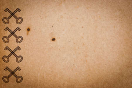 Rusty keys on old paper background with blended layers
の写真素材