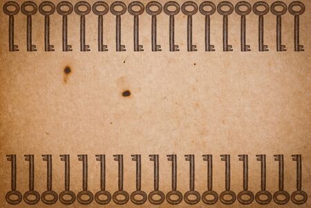Rusty keys on old paper background with blended layers
の写真素材
