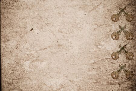 Rusty keys on old paper background with blended layers
の写真素材