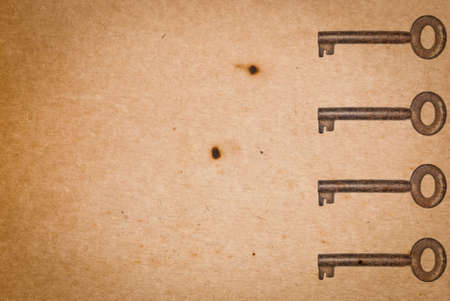 Rusty keys on old paper background with blended layers
の写真素材