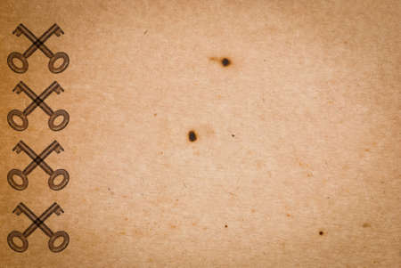 Rusty keys on old paper background with blended layers
の写真素材