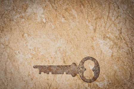 Rusty keys on old paper background with blended layersの写真素材