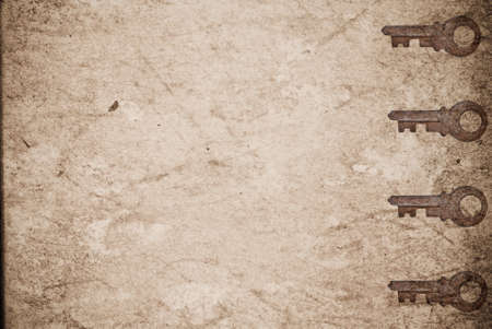 Rusty keys on old paper background with blended layers
の写真素材