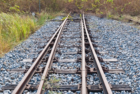 Rail way going toward a dead end taken on a sunny afternoon
