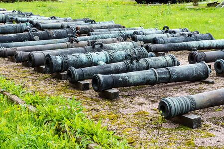 Old vintage Russian artillery systems and equipment on green grass taken on a sunny day, can be use...