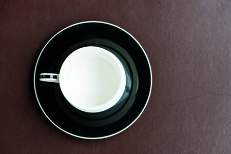 Cup of coffee on a brown mat, can be use for various foods related concept design and background.の写真素材