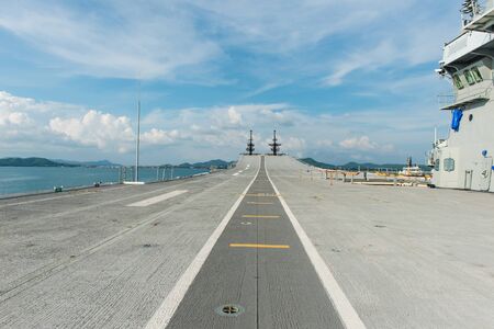 Concrete fighter jet run way of an aircraft carrier, taken on a sunny day in Thailandの写真素材