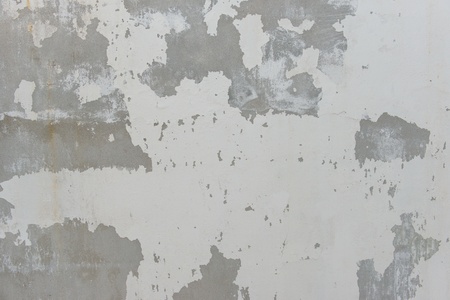 Cracks on solid white painted concrete wall, large and small crack, symbolized danger and destructionsの写真素材
