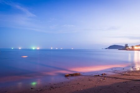 Colorful night sea, at twilight with blue sky の写真素材
