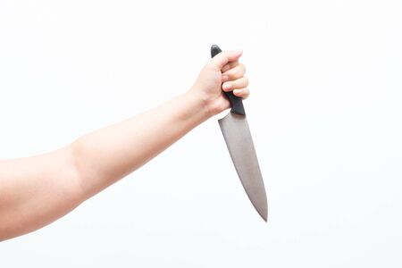 Asian woman holding large knife, isolatedの写真素材
