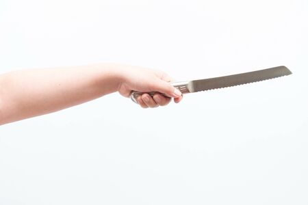 Asian woman holding large knife, isolatedの写真素材
