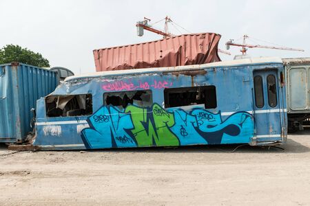 A wreckage of passenger train from train yard on a sunny dayのeditorial素材