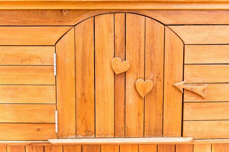 Wooden texture with love sign and symbol embedded into itの写真素材