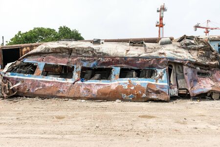 A wreckage of passenger train from train yard on a sunny dayの写真素材