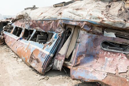 A wreckage of passenger train from train yard on a sunny dayの写真素材