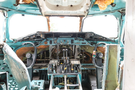 Inside airplane wreckage cockpit, taken on a sunny day, useful for plane safety, pilot, flights, air craft, aero space industry, travel, holiday, insurance related conceptsの写真素材