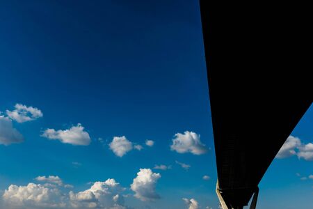 Silhouette of highway ramps on a sunny day, useful for construction, engineering, transportation,...