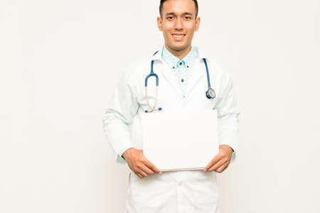 Asian male medical doctor on white background, useful for medical, hospital, medication, surgent, medical advise, doctor, health care conceptsの写真素材