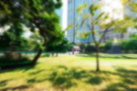 Blur background outdoor recreation public park in urban city in morning for urban relaxation enjoyment family fun exercising, yoga, tai chi, running, jogging, resting design conceptsの写真素材