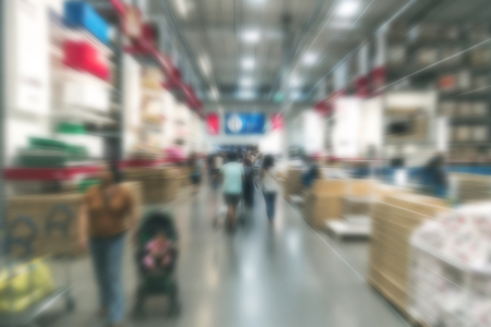 Blur background large indoor warehouse with high racks and products store on it for supply chain...