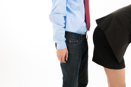 Young confident Asian office employee business man stand close to attractive Asian office woman buttom. For office sexual harassment offender abuse behavior in office cooperate communication designの写真素材