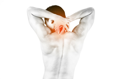 Fitness and health concept. Fit sport man having neck injury, isolated on white background in studio. Half naked Asian chinese lean muscular male wearing a black shorts.の写真素材