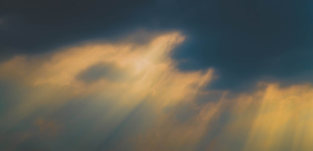 rays of light through dark cloud
