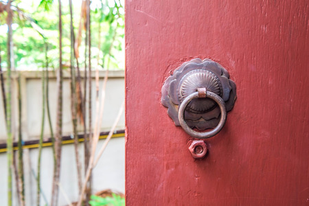 Vintage Chinese door opening to gardenの写真素材