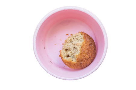 bitten banana cupcake in pet platedの写真素材