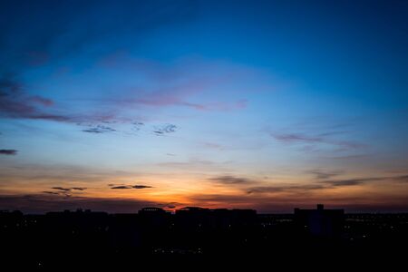 Silhouette rural town and sky in sunriseの写真素材