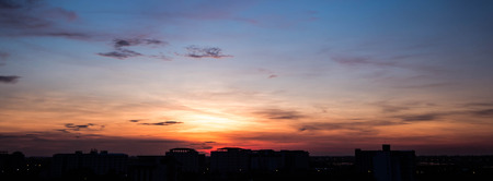 Silhouette rural town and sky in sunrise panoramaの写真素材